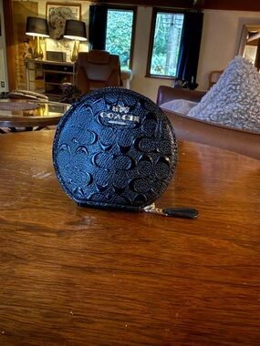 Coach Black Embossed Signature Round Zip Coin Case with Gold Plaque